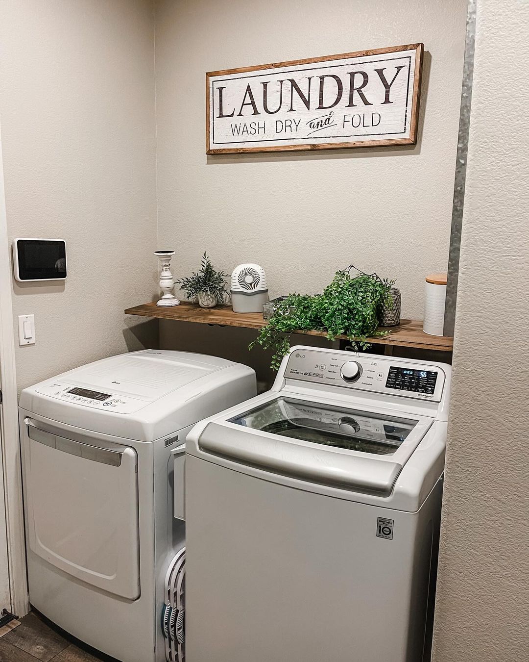 Rustic Laundry Room with Wood Accents and Greenery