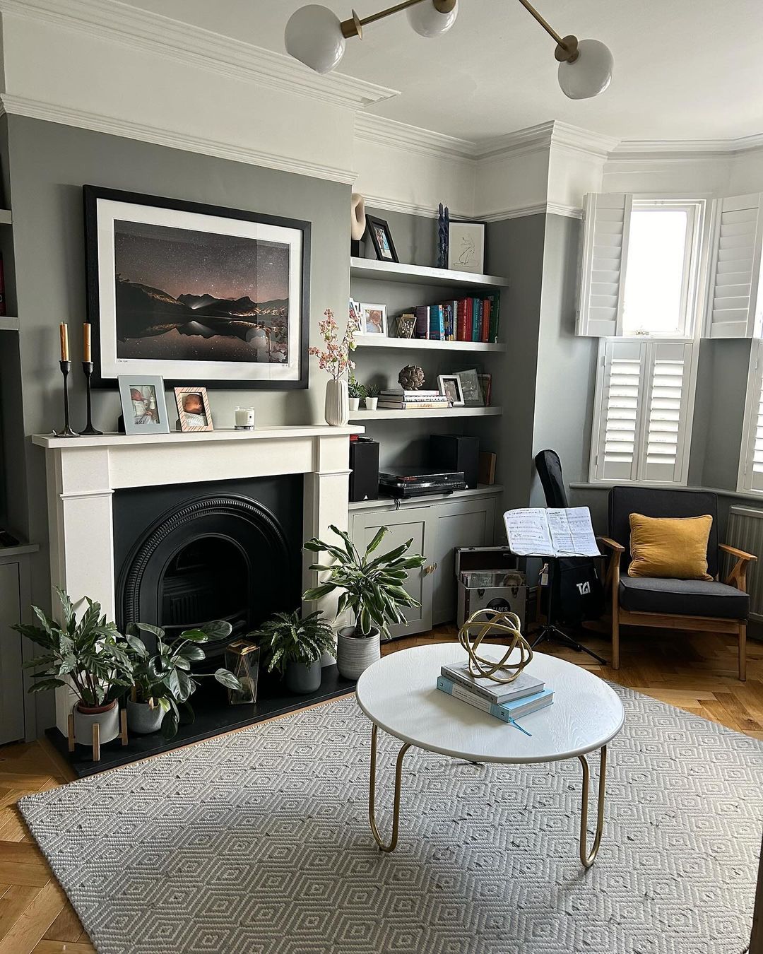 Sophisticated Reading Room with Fireplace and Greenery