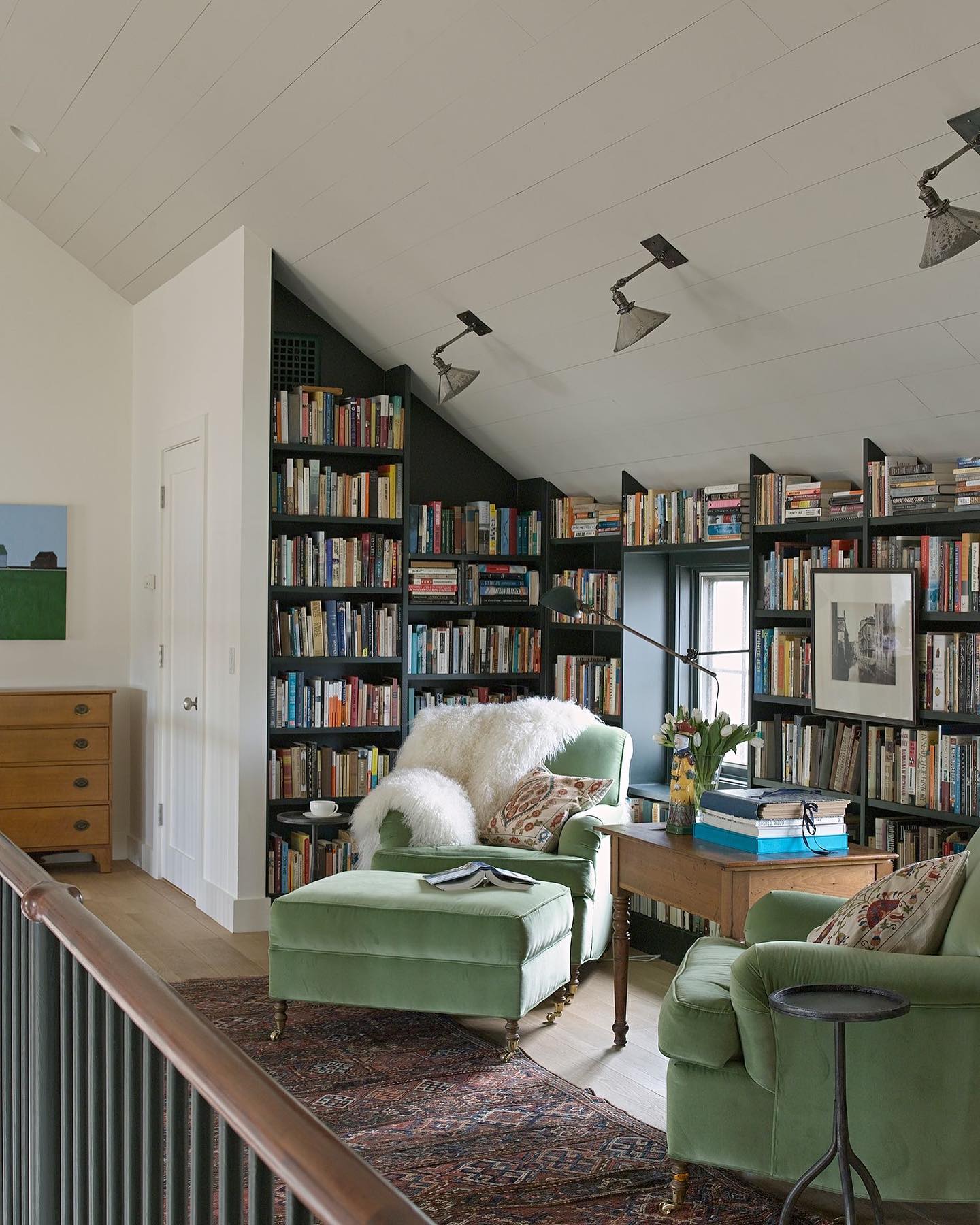 Attic Reading Room with Plush Seating and Extensive Shelving