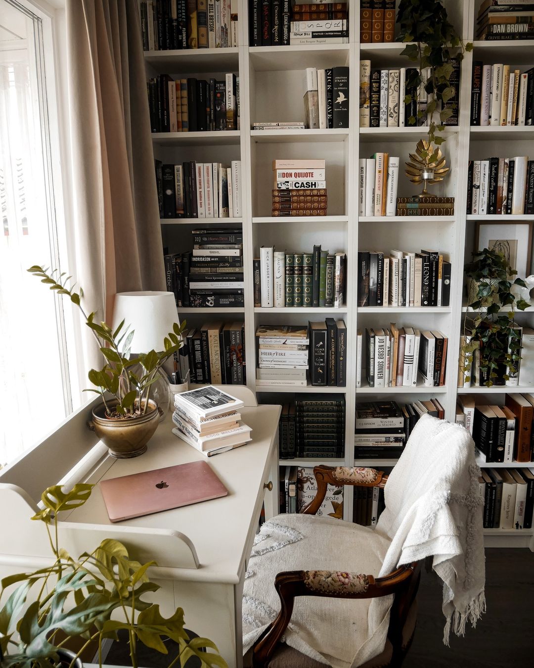 21. Compact Reading Nook with Desk and Bookshelves