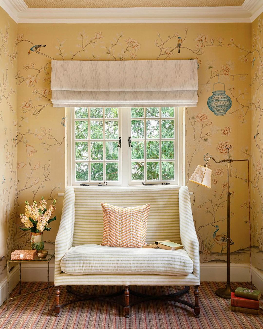 22. Serene Reading Corner with Window Seat and Floral Wallpaper