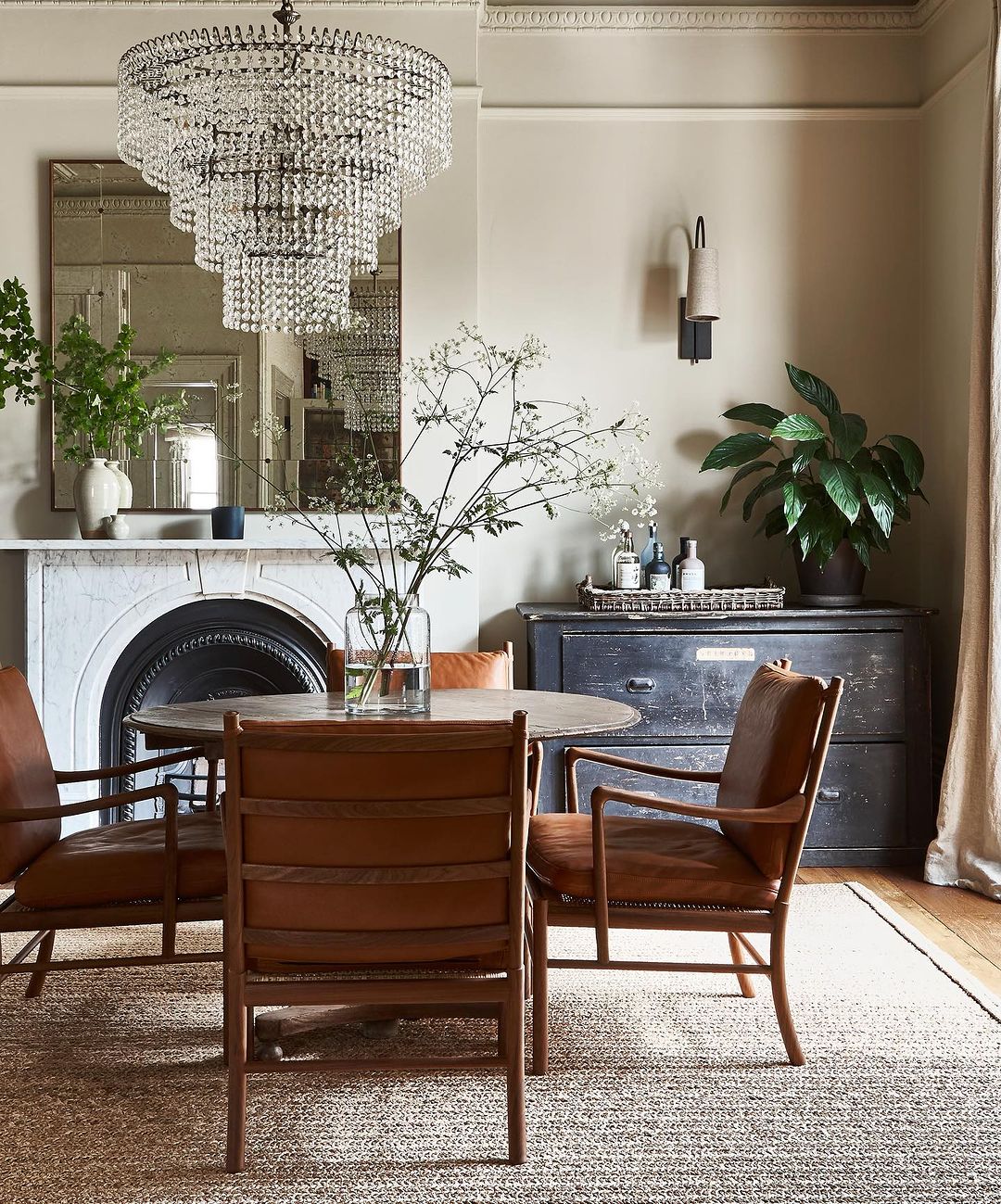 Vintage Charm with a Crystal Chandelier and Marble Fireplace