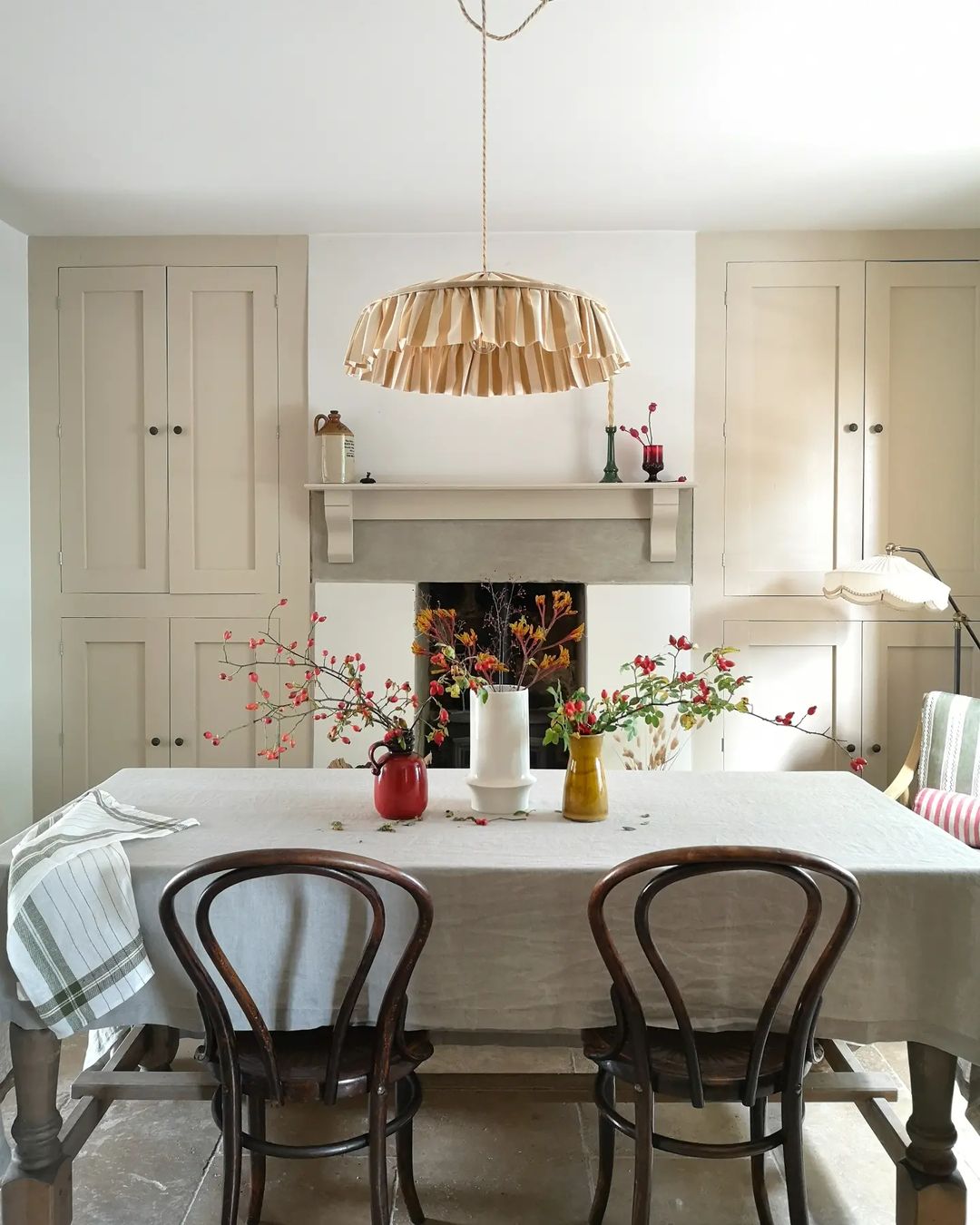 Quaint and Charming Dining Room with a Stone Fireplace