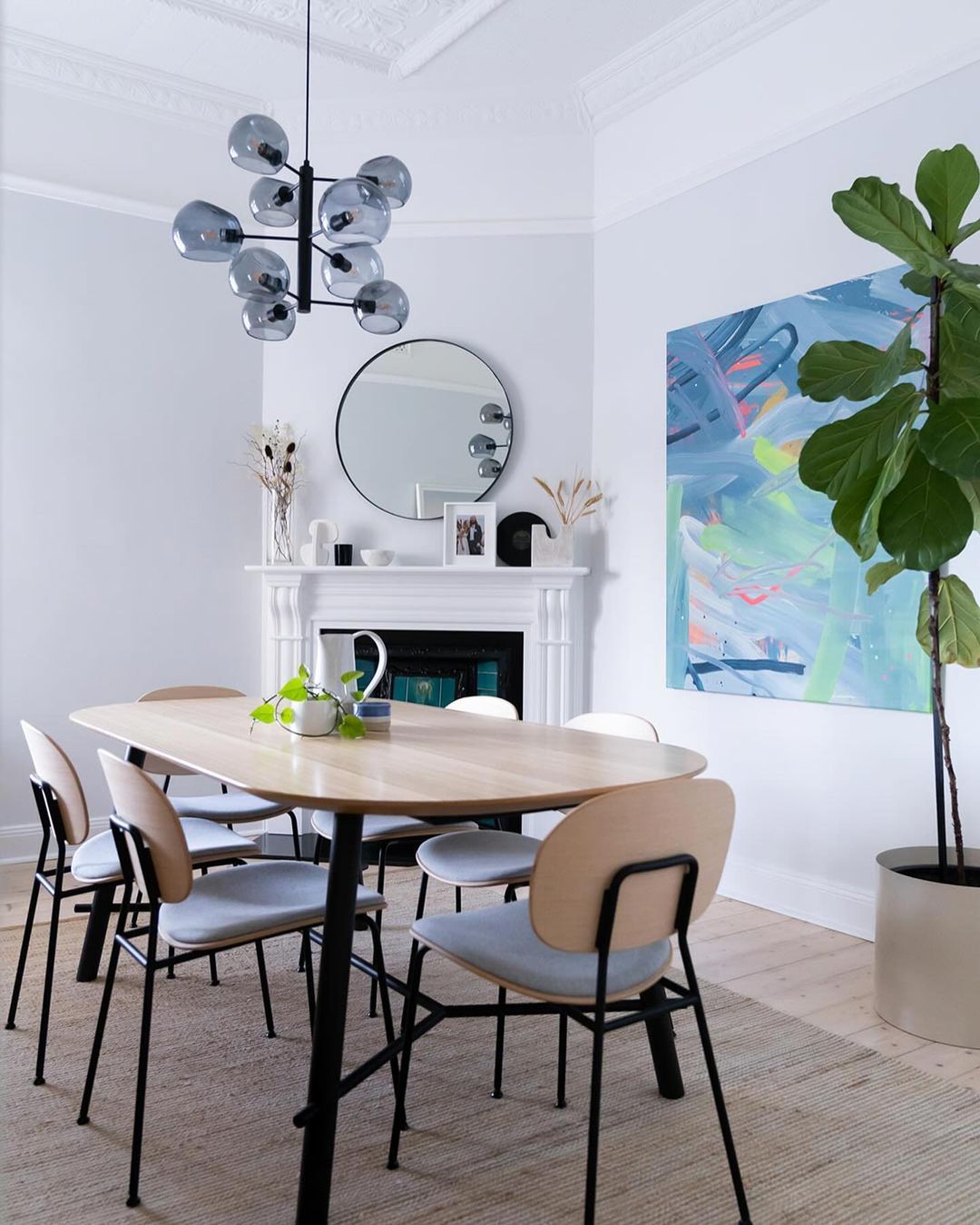 Contemporary Minimalist Dining Room with a White Fireplace