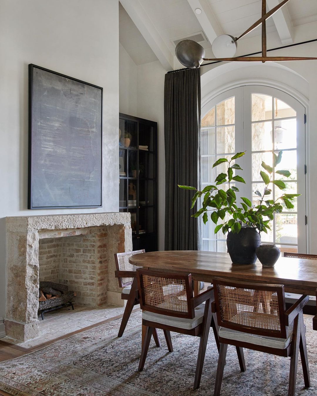 Rustic Modern Dining Room with an Exposed Brick Fireplace