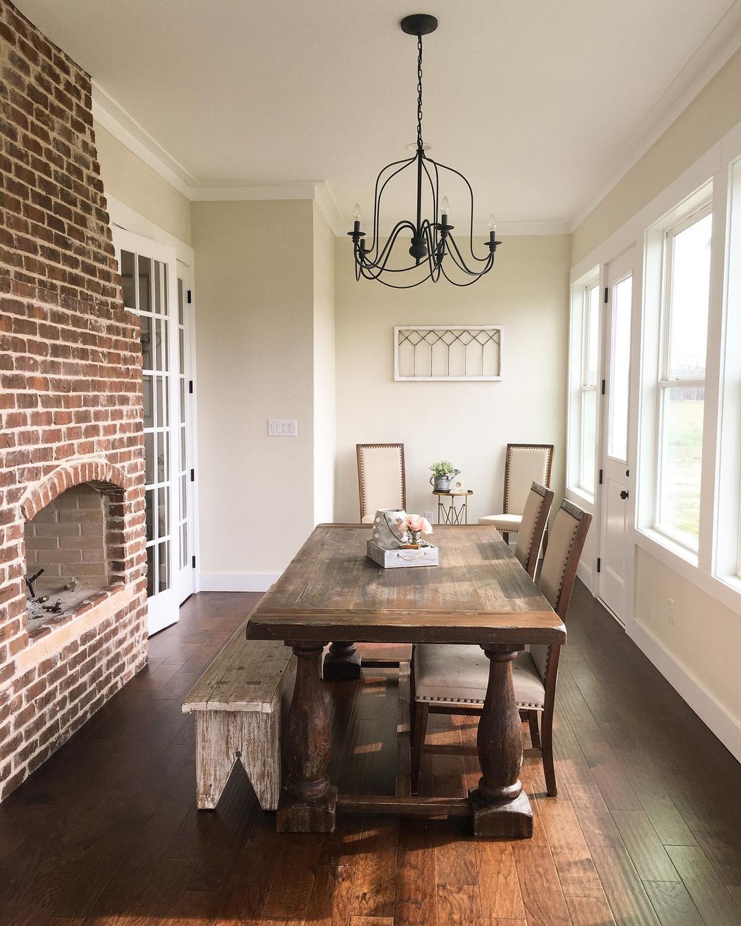 Cozy Farmhouse Dining Room with a Brick Fireplace