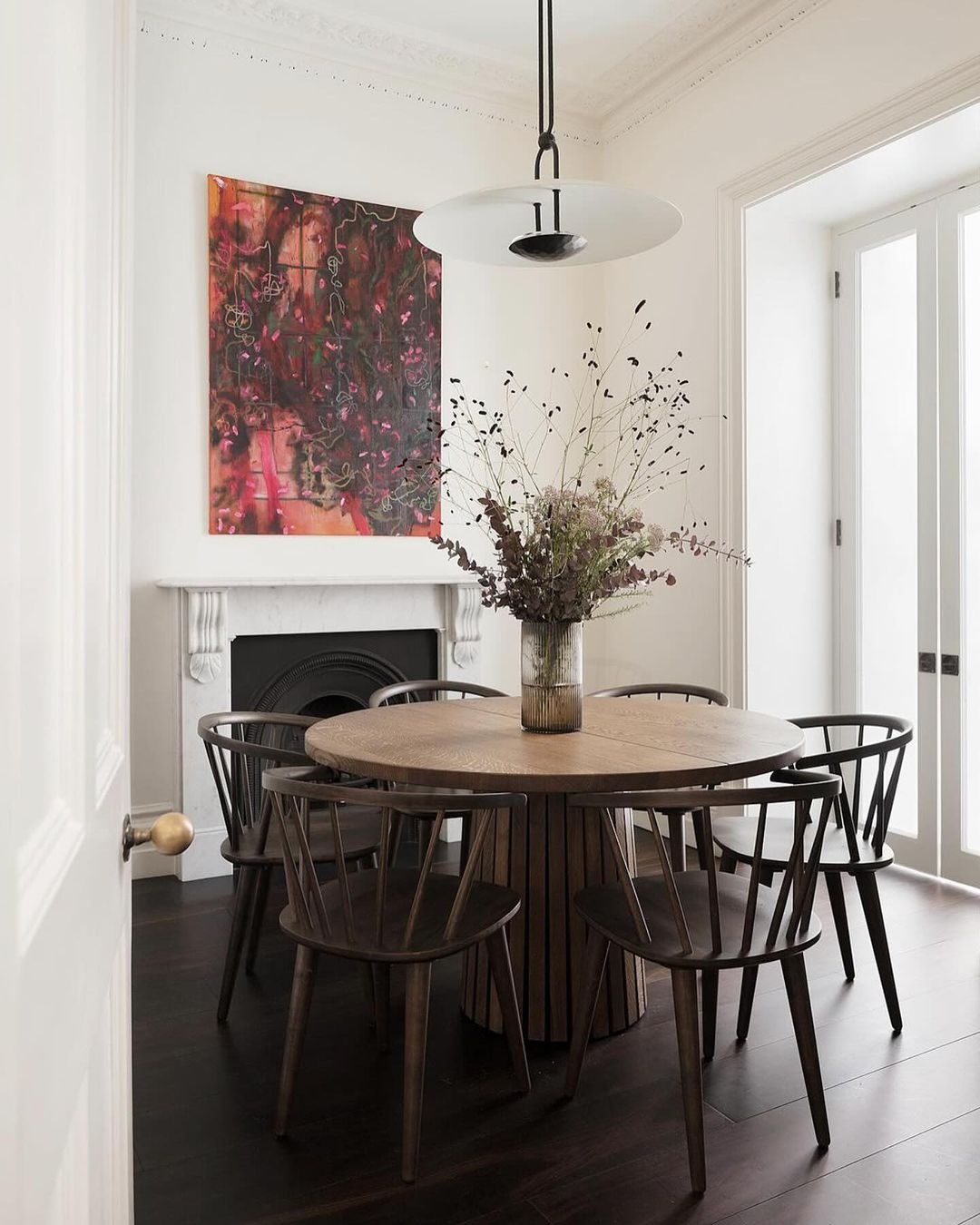 Minimalist Chic Dining Room with a Classic Fireplace