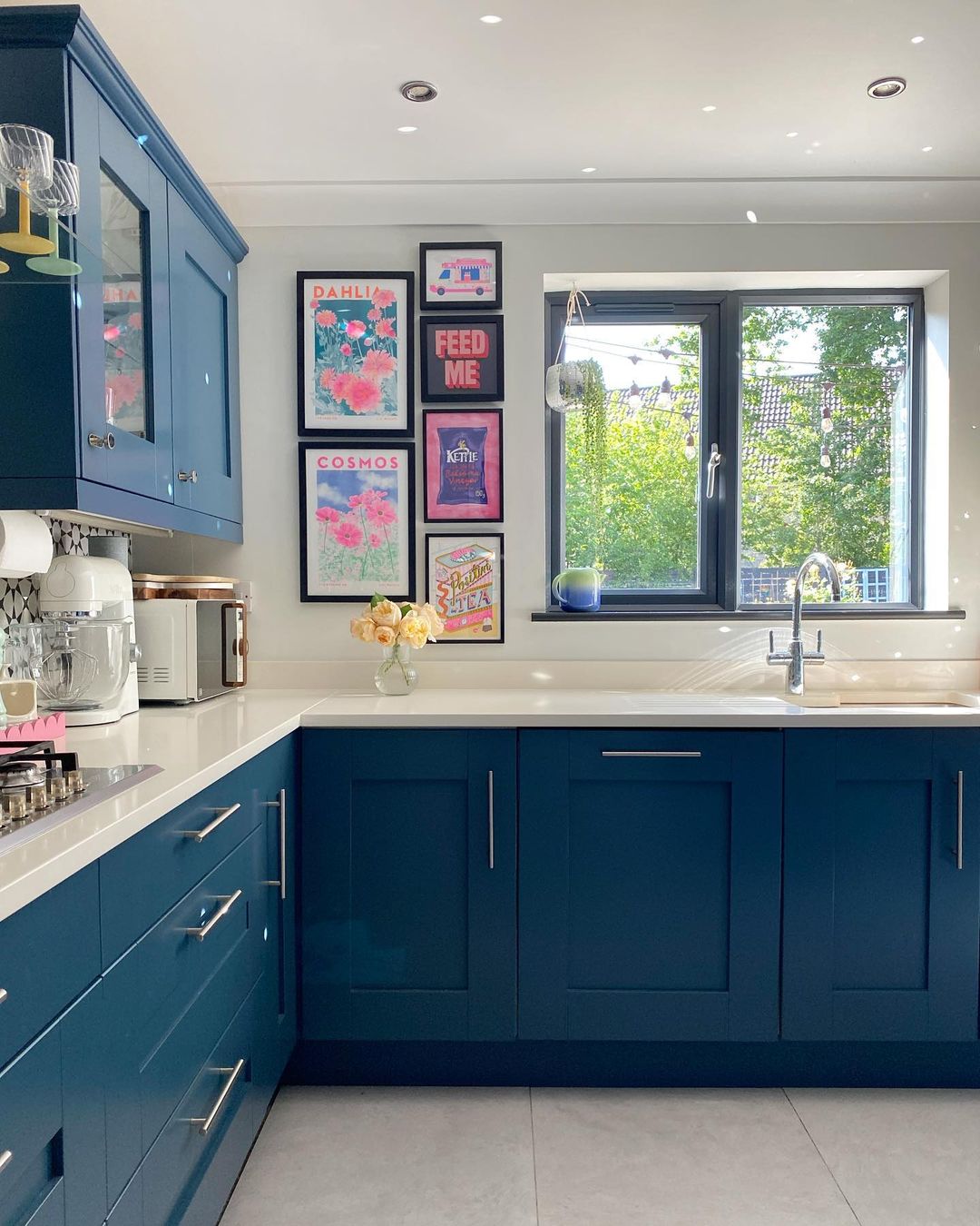 Bold Blue Cabinets with Modern Art