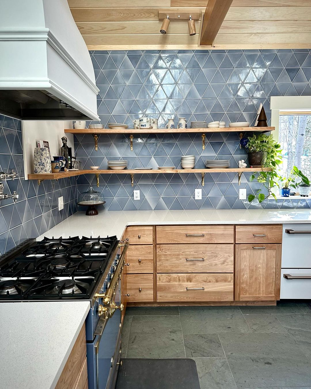 Blue Cabinets with Geometric Tile Backsplash