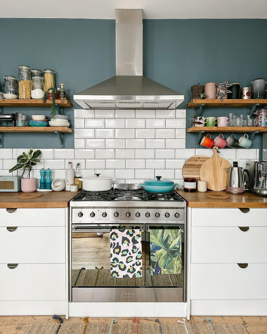 Blue Accent Wall with White Cabinets