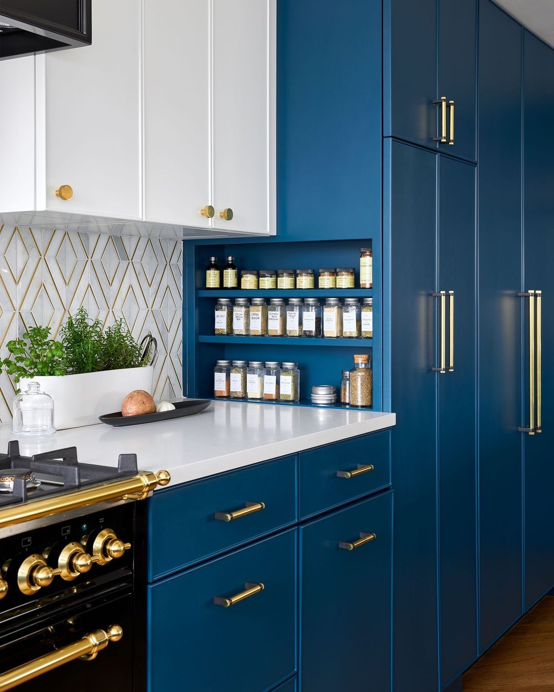 Elegant Blue Cabinets with Brass Accents