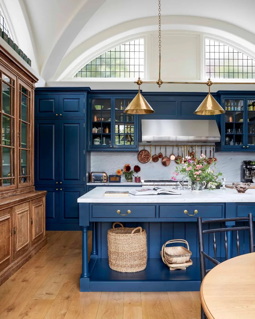 Rich Blue Cabinets with Brass Fixtures