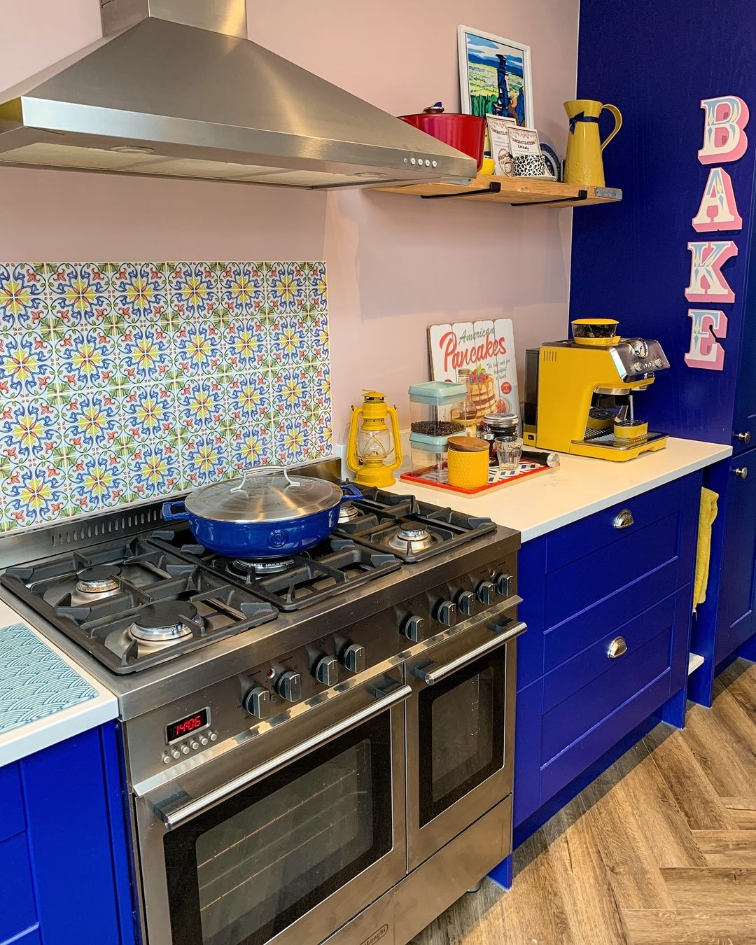 Deep Blue Cabinets with Vibrant Backsplash