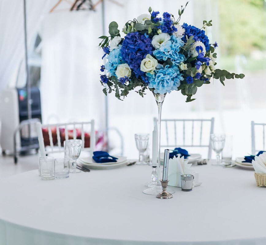 15. Tall Blue and White Floral Centerpiece