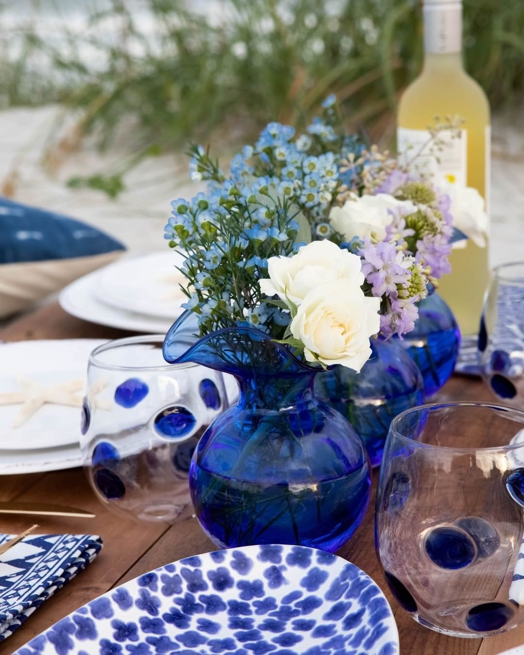 Rustic Blue Glass and Floral Centerpiece