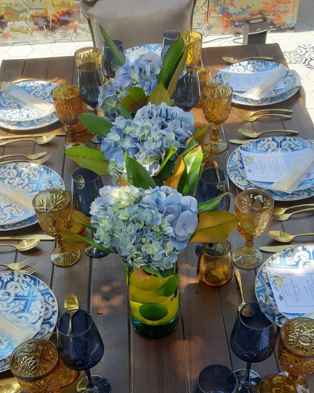 Vibrant Blue Hydrangea and Citrus Centerpiece