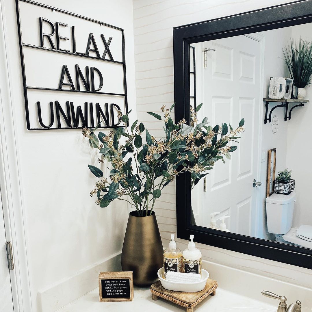 Modern Wall Art and Greenery for a Relaxing Bathroom