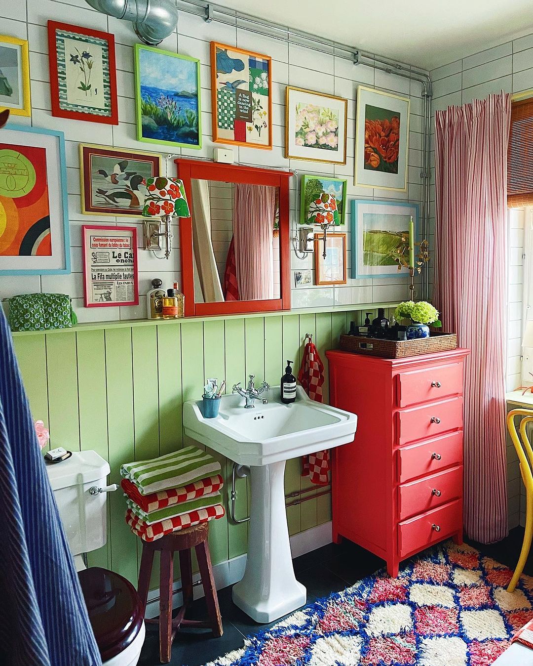 Colorful Gallery Wall for a Playful Bathroom Decor