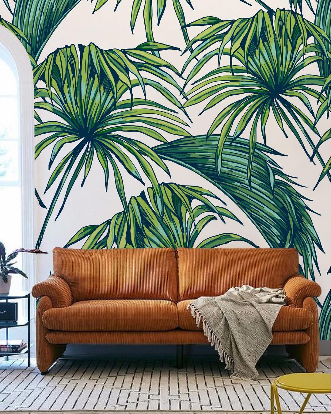 Create a Tropical Vibe with Bold Wallpaper and a Tan Couch