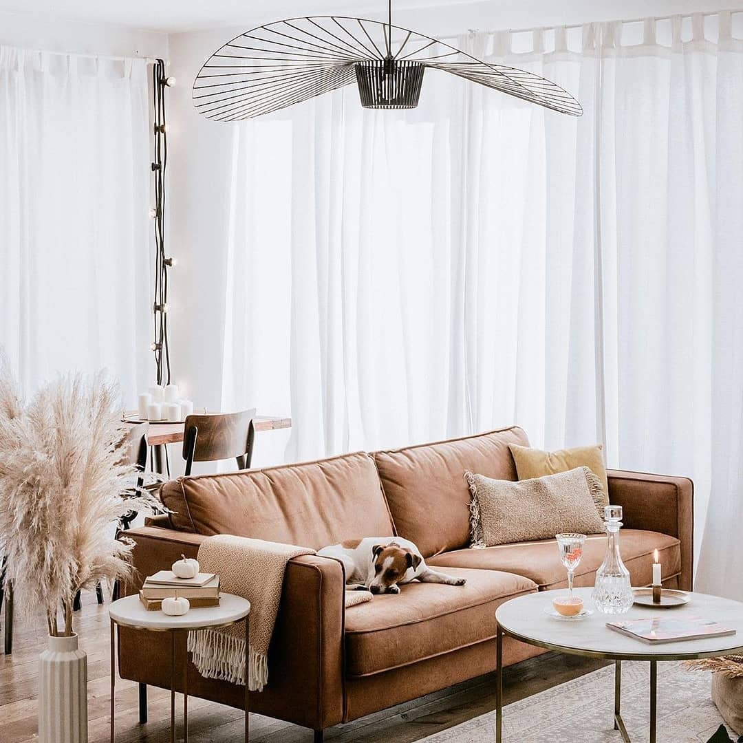 Achieve a Light and Airy Feel with a Tan Couch and Soft Accents