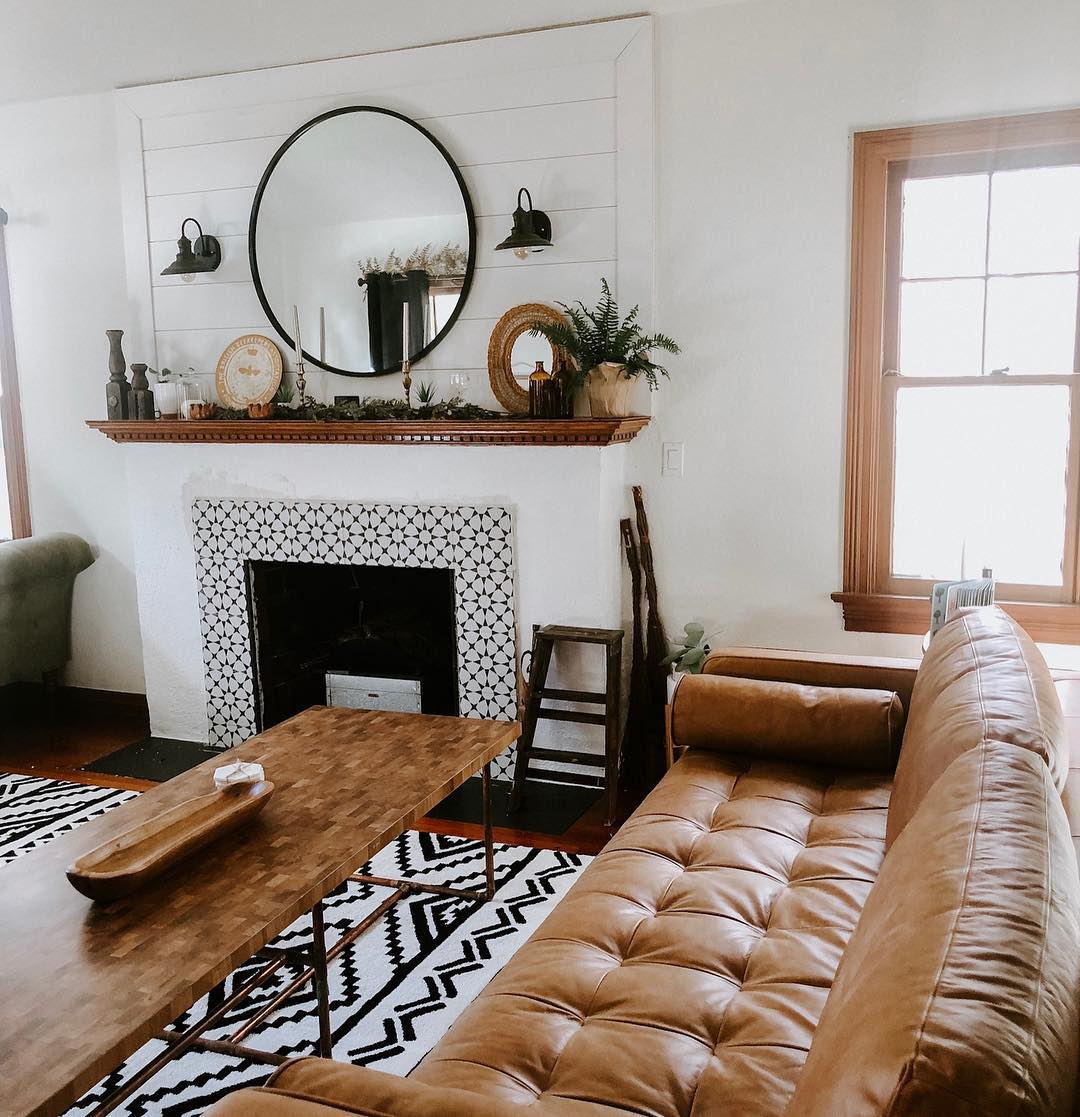 Add Cozy Charm with a Tan Couch and Fireplace Focal Point