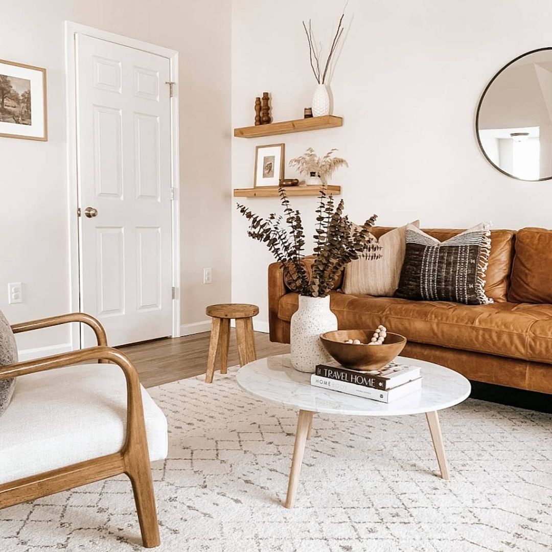 Embrace Minimalism with Warm Accents and a Tan Couch