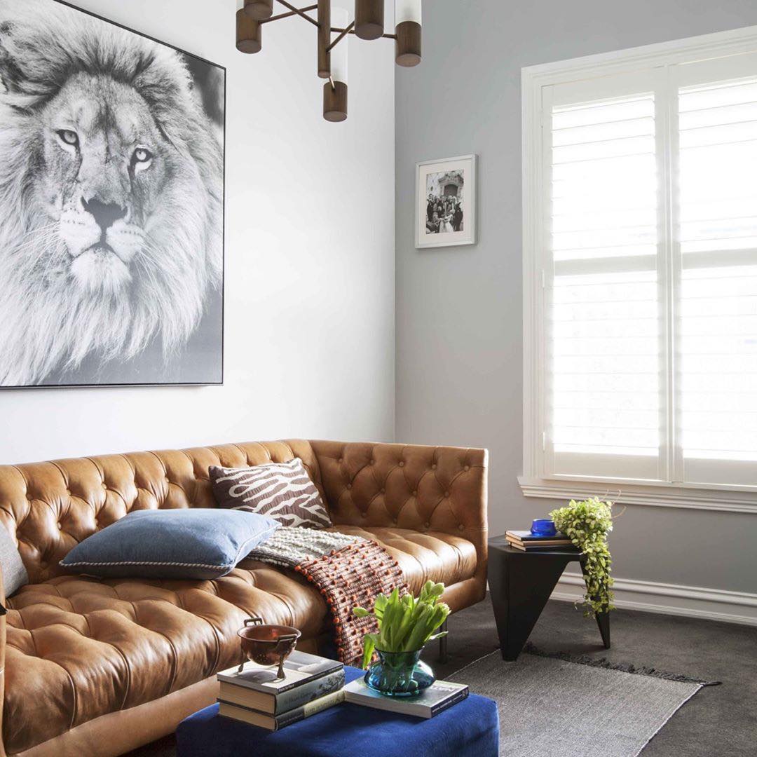 Achieve Modern Elegance with Bold Art and a Tan Couch