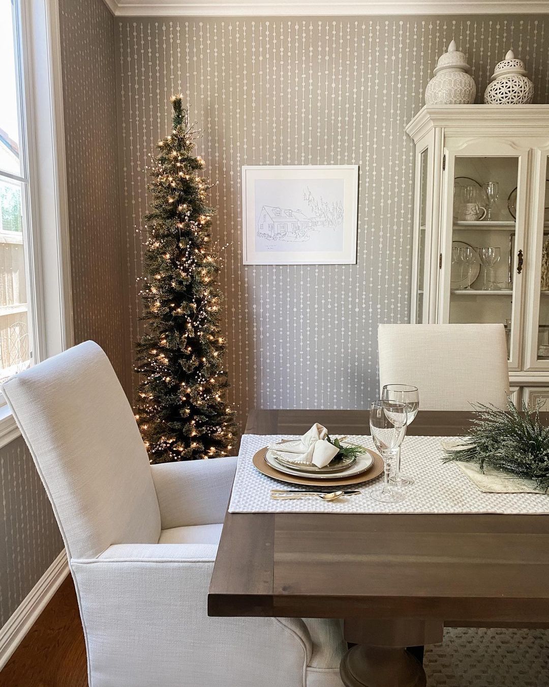 Add Elegance to Your Dining Room with a Slim Christmas Tree and Subtle Decor