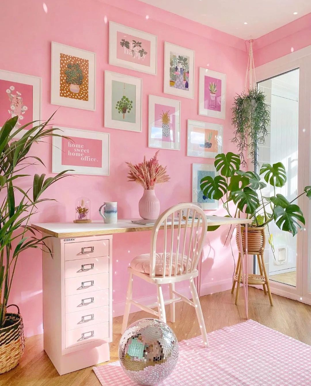 Vibrant Pink Gallery Wall for an Inspiring Office