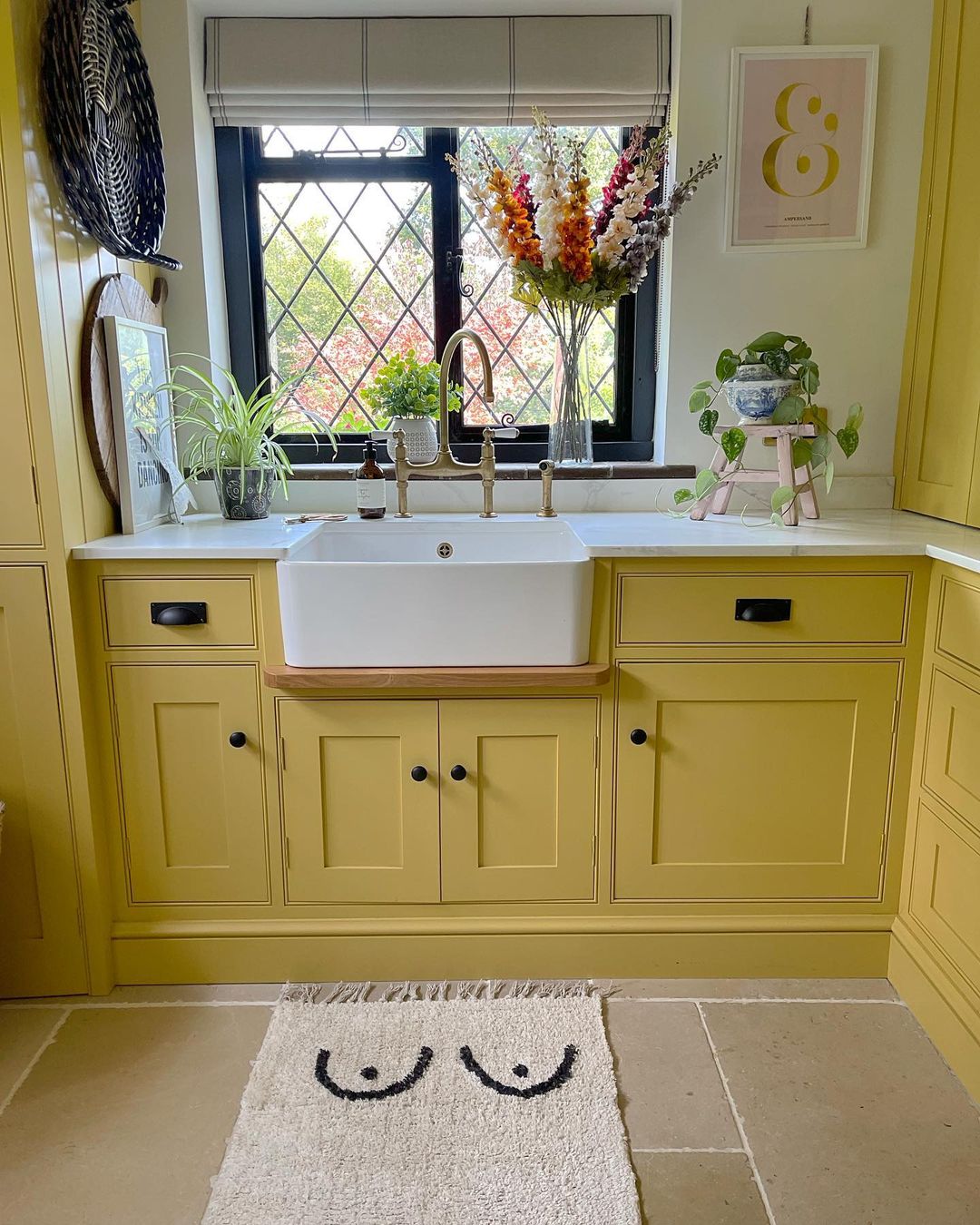 Cozy Yellow Cabinets with Farmhouse Sink