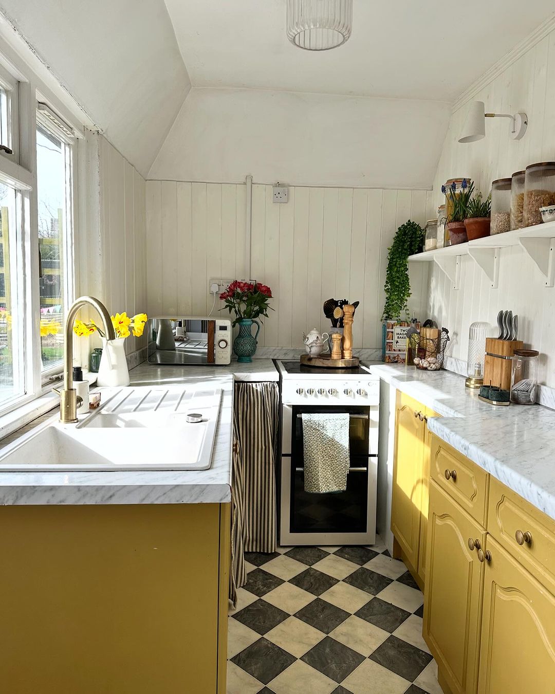 Cozy Yellow Cabinets in a Compact Kitchen