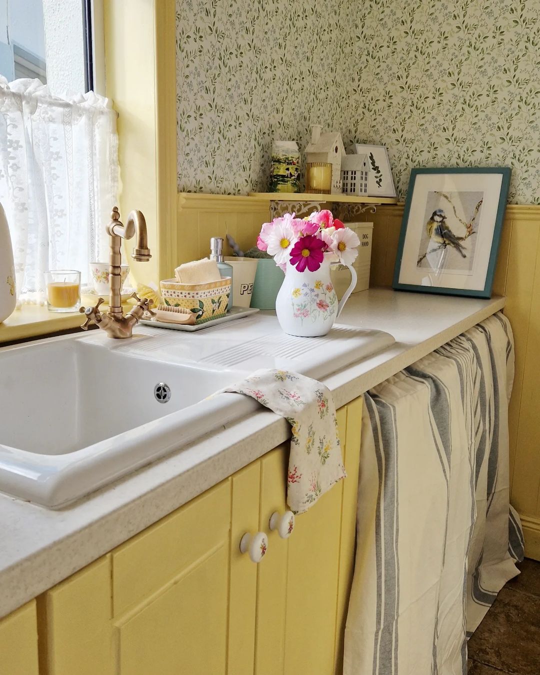 Soft Yellow Cabinets with Floral Decor