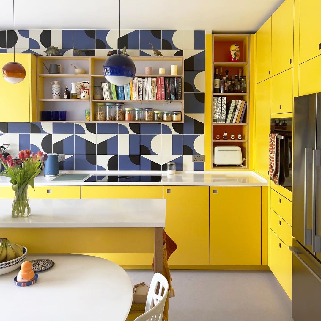 Bold Yellow Cabinets with Geometric Backsplash