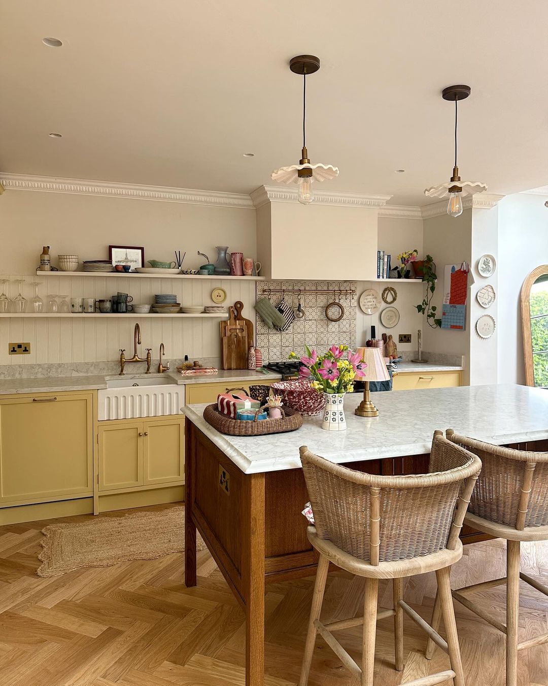 Elegant Yellow Kitchen with Marble Countertops