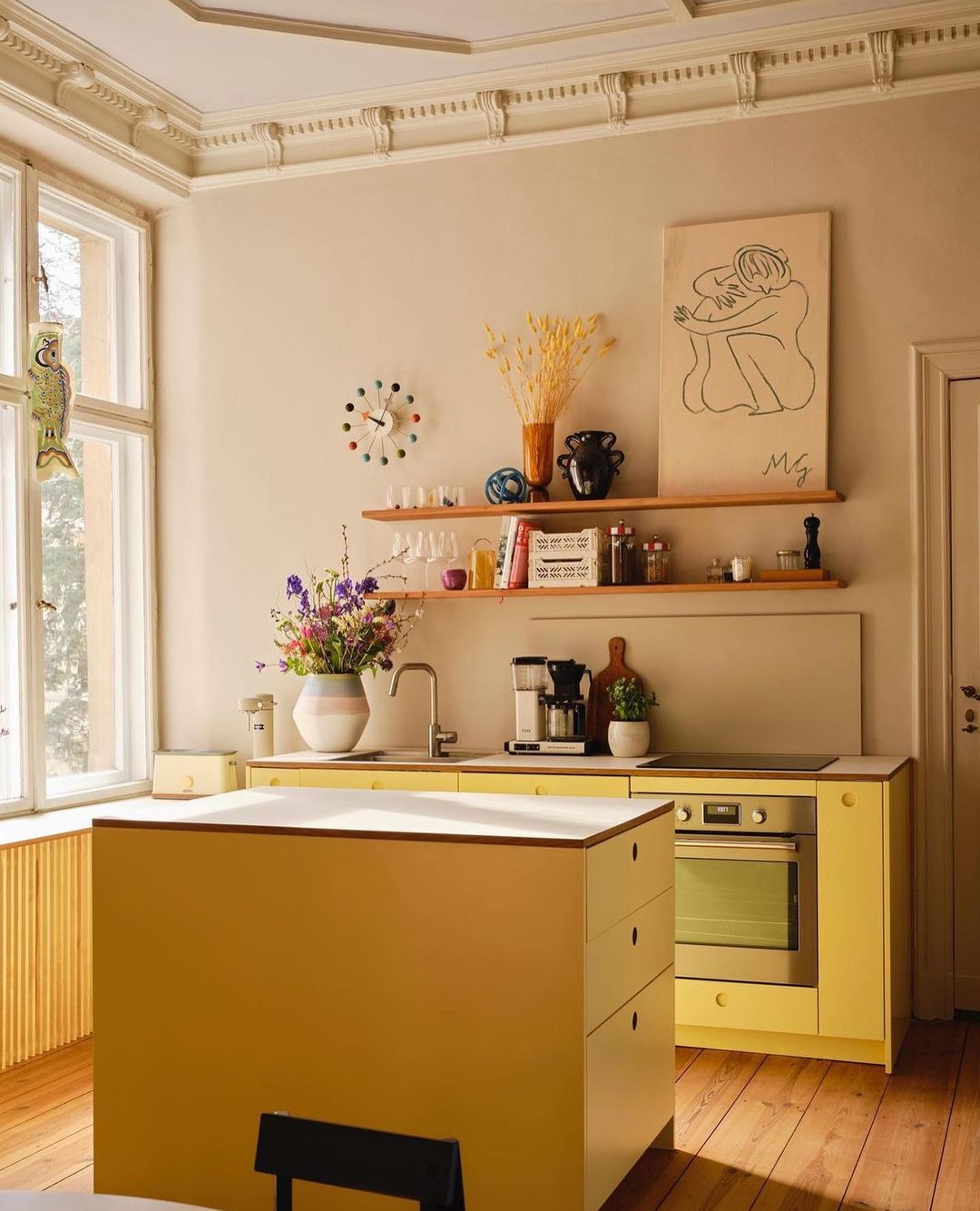 Soft Yellow Cabinets with Warm Wood Accents