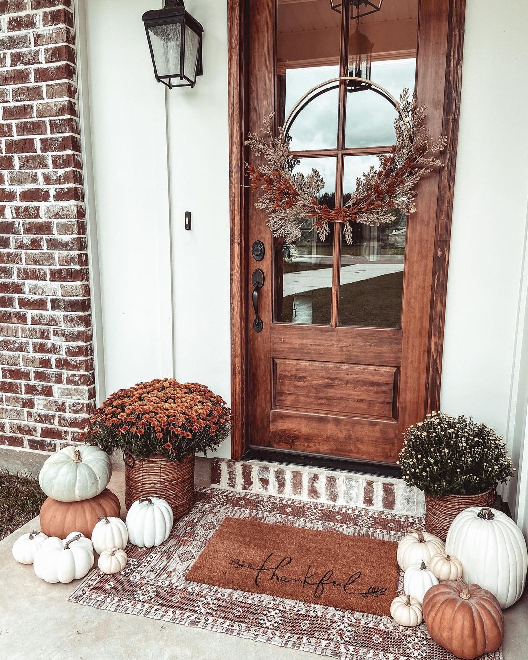 24. Warm Boho Fall Porch with Rustic Elements