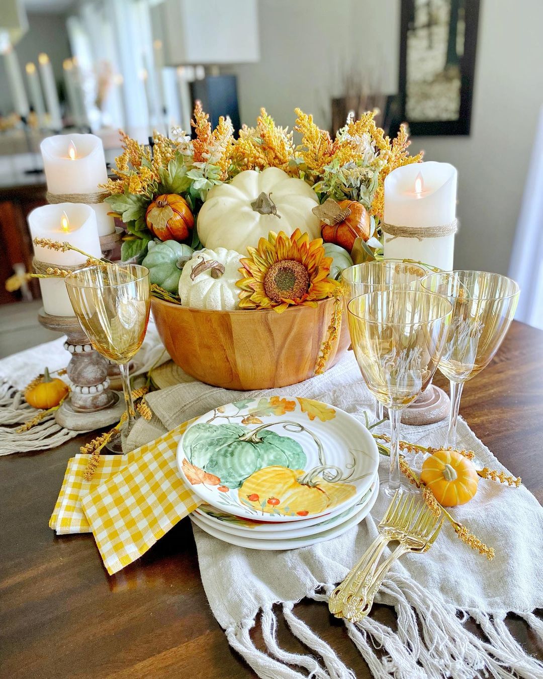 7. Harvest-Inspired Pumpkin and Sunflower Centerpiece