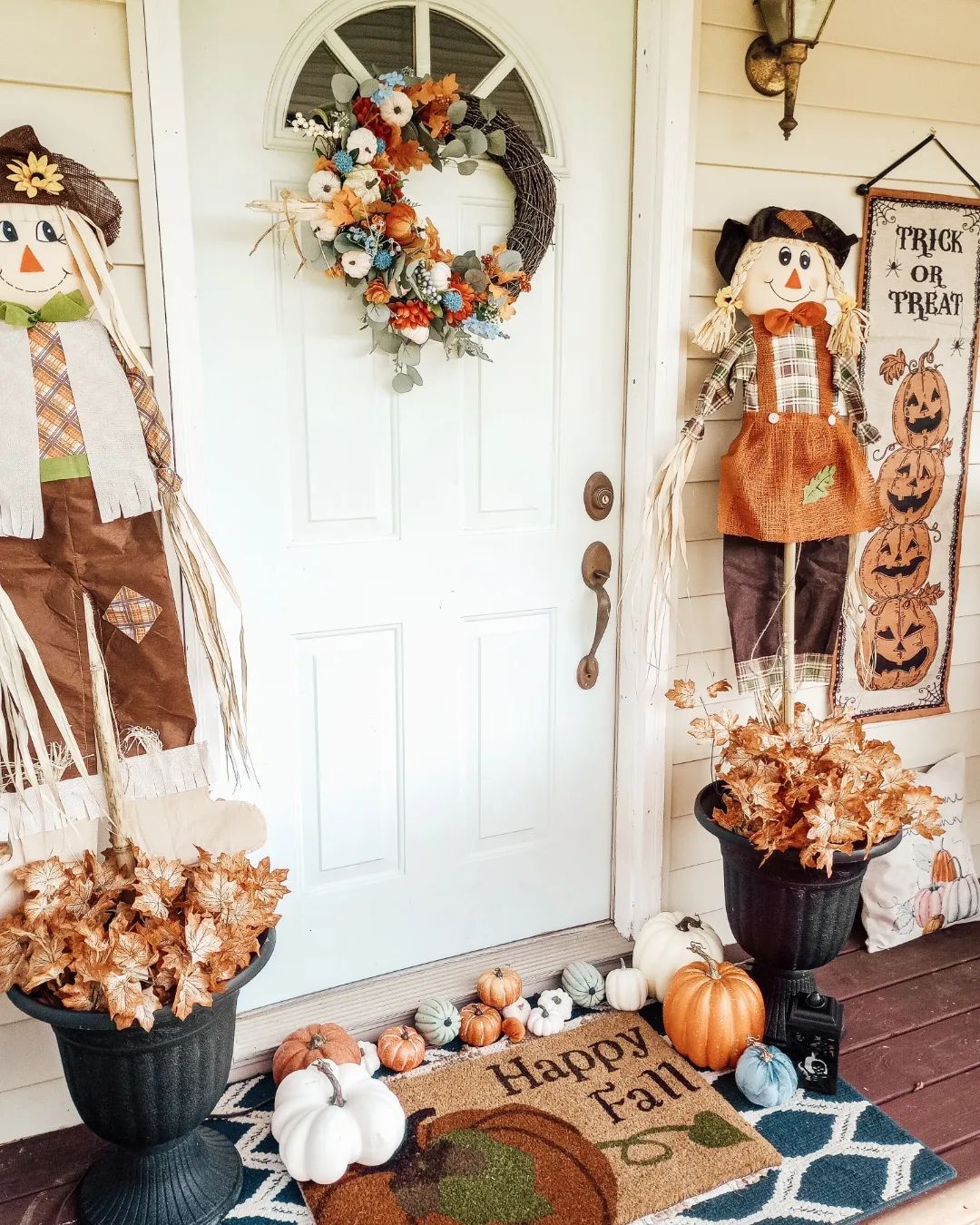 Charming Fall Porch with Scarecrow Duo