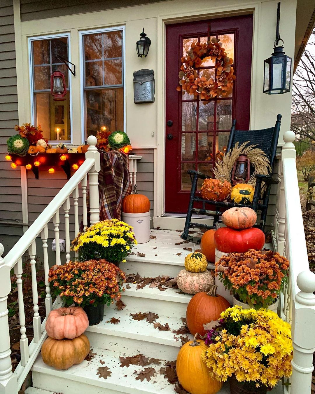 Festive Fall Porch with Cozy Lighting and Pumpkins