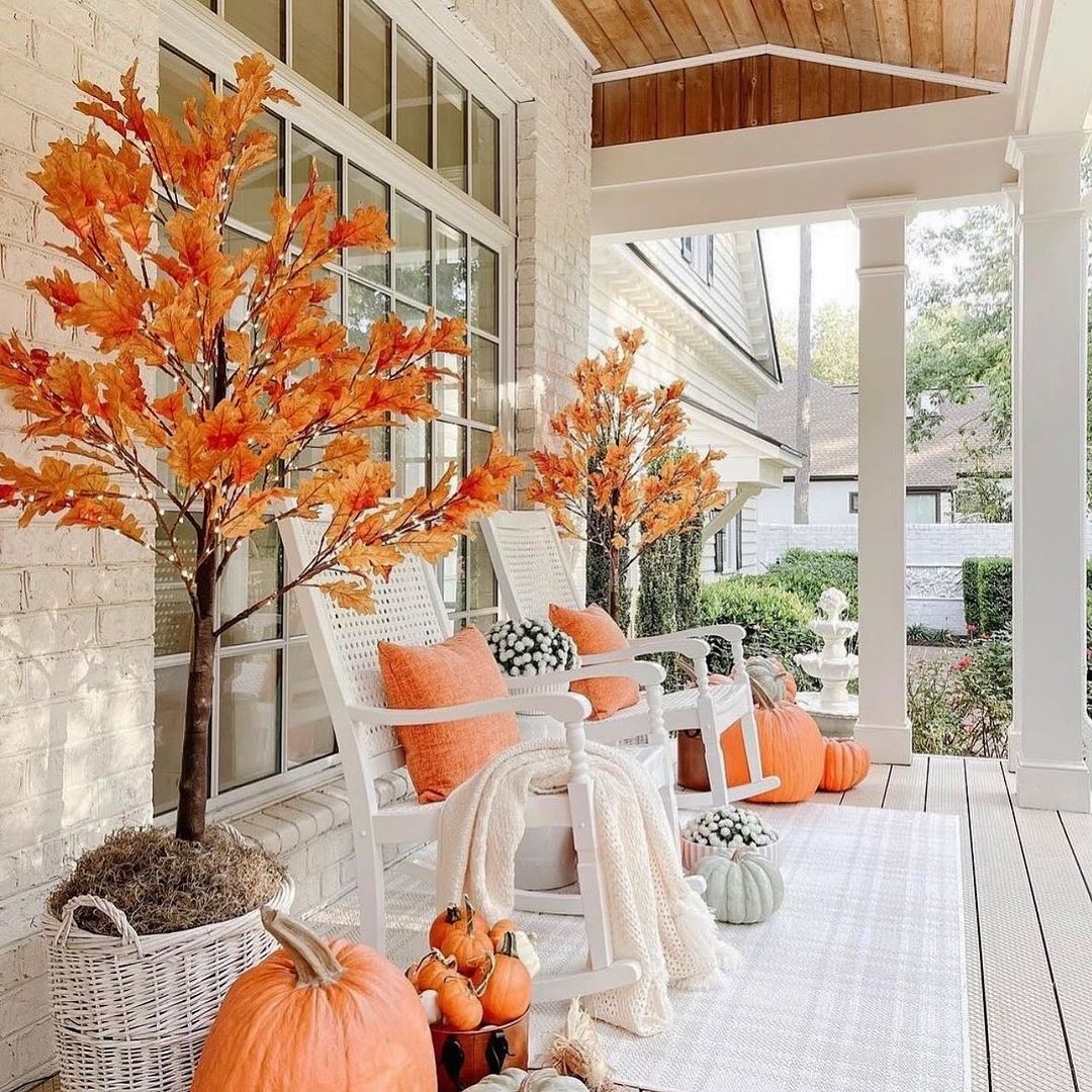 Cozy Porch with Vibrant Fall Foliage and Rocking Chairs