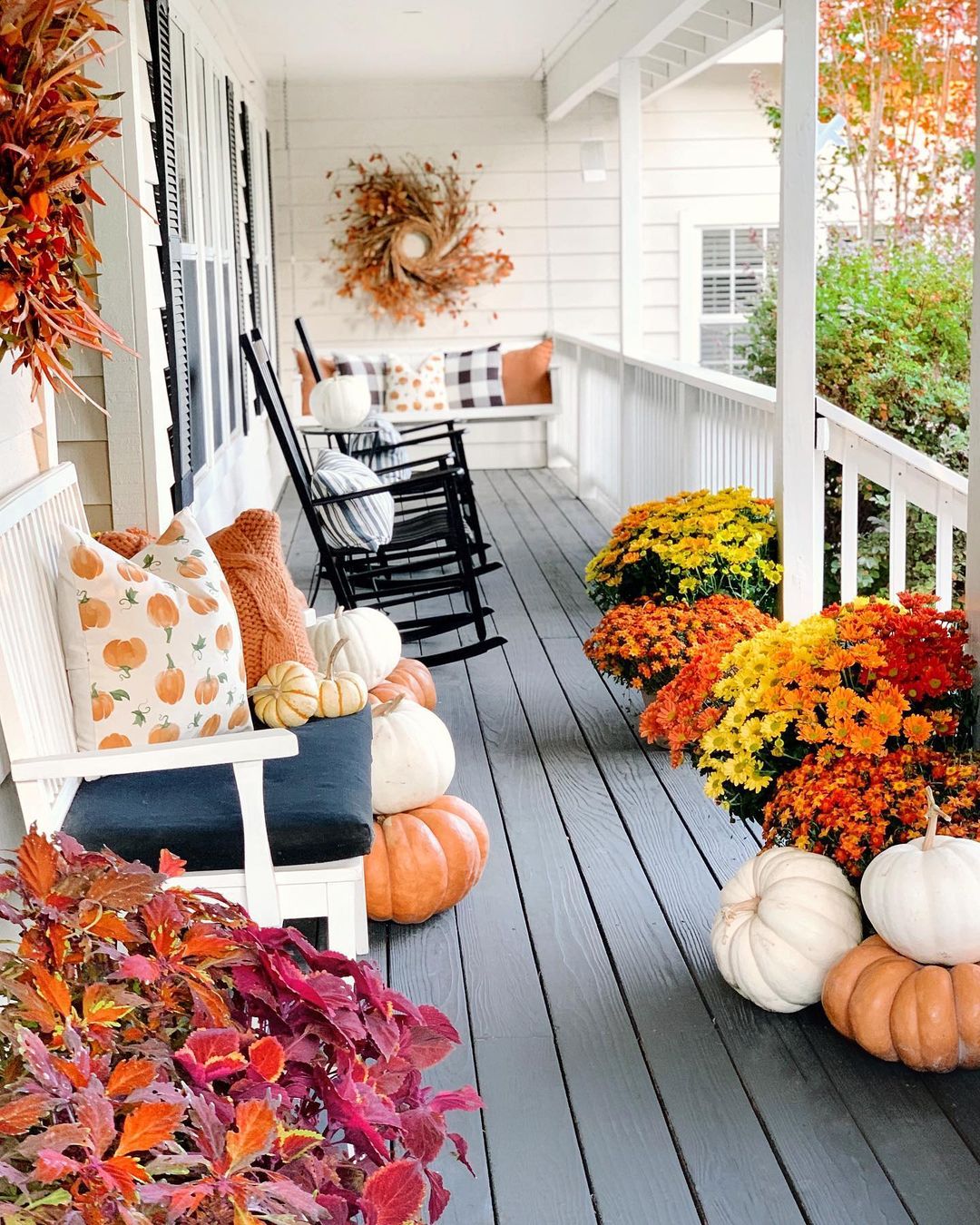 Inviting Fall Porch with Rocking Chairs and Seasonal Decor