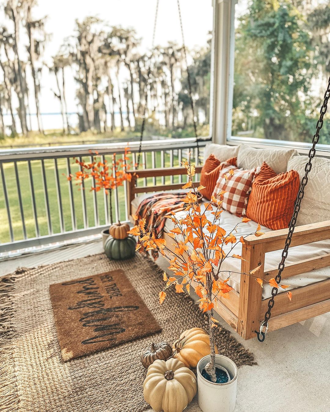 Relaxing Fall Porch with Swing and Autumn Decor