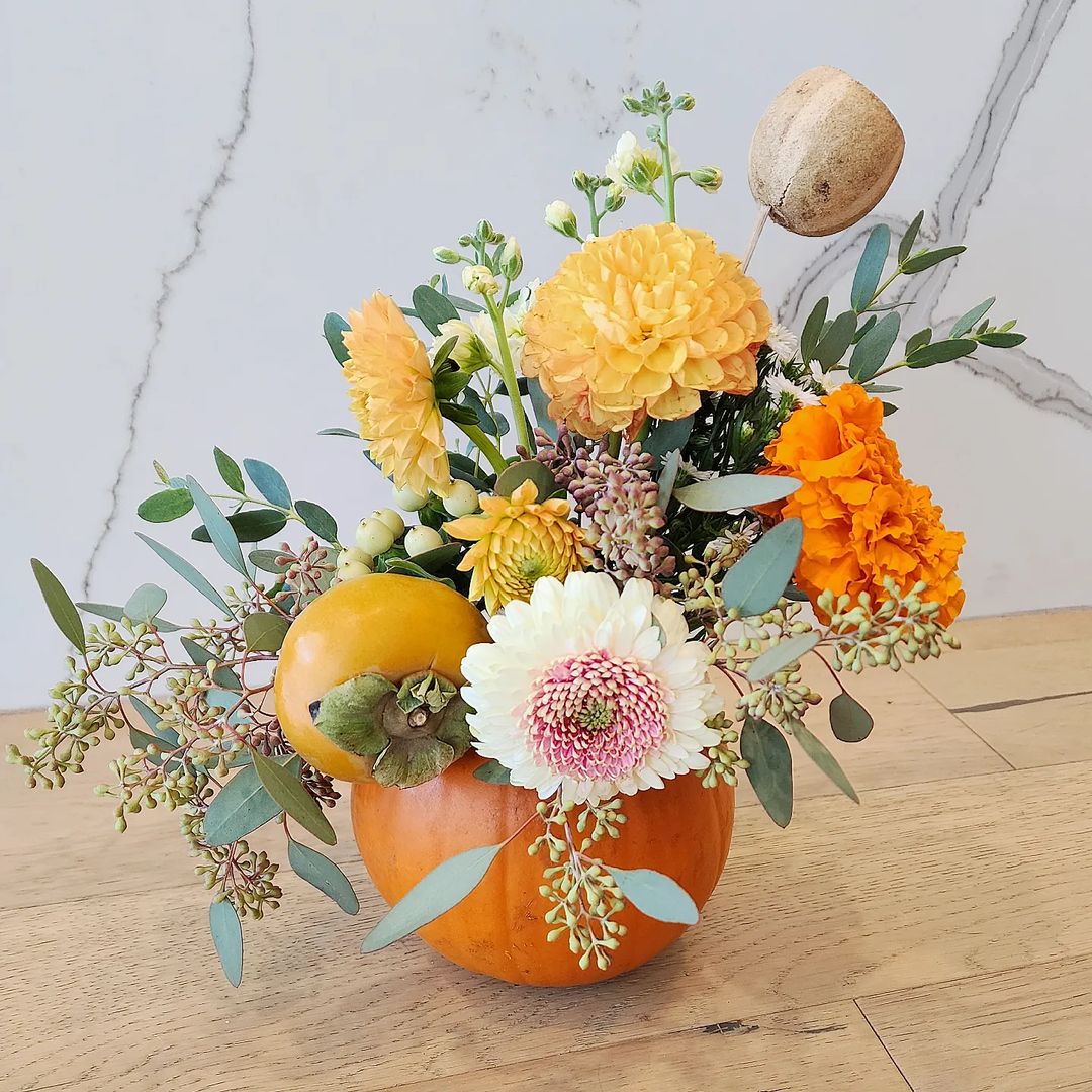 Cheerful Marigold Pumpkin Floral Arrangement