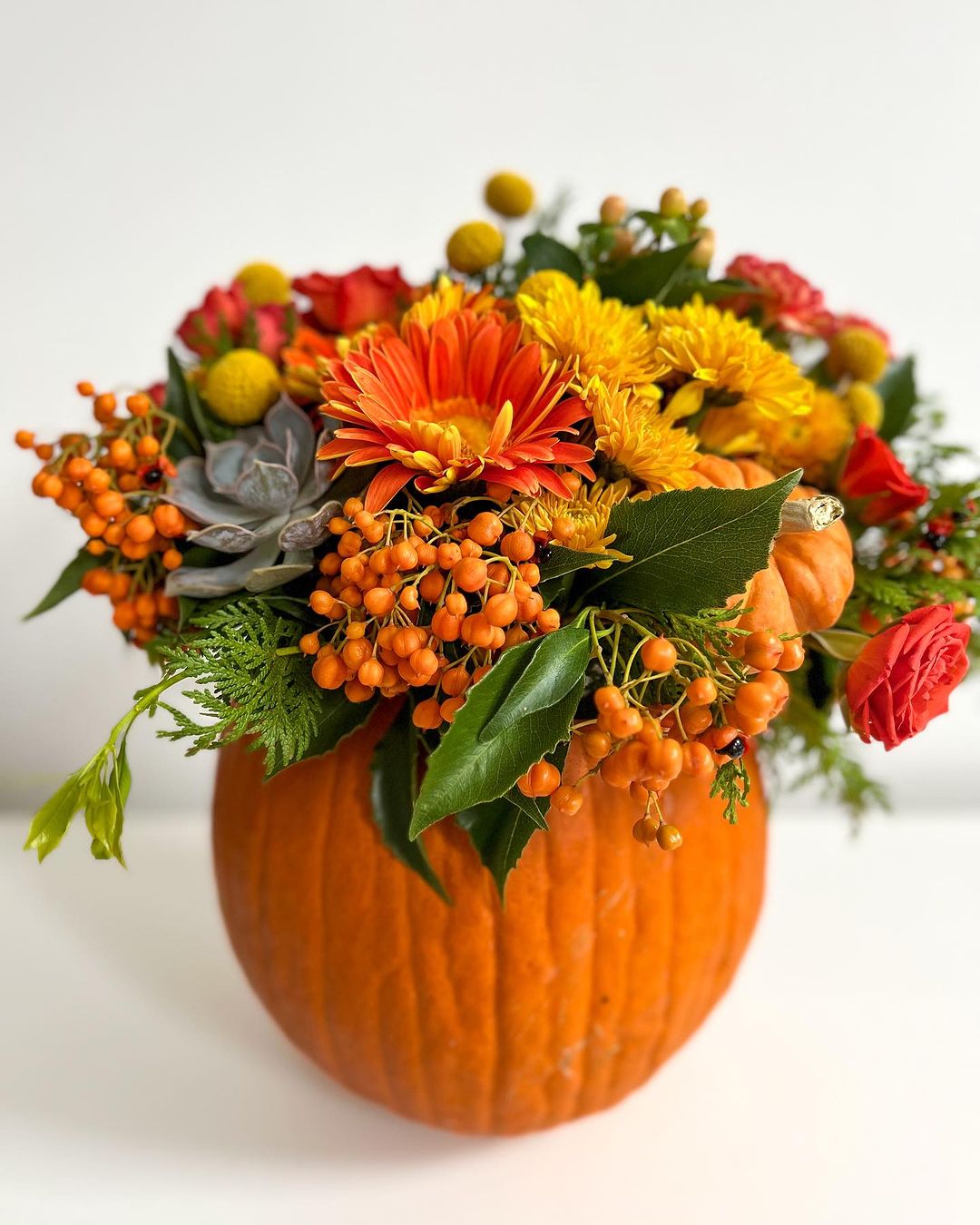 Vibrant Orange Pumpkin Floral Arrangement