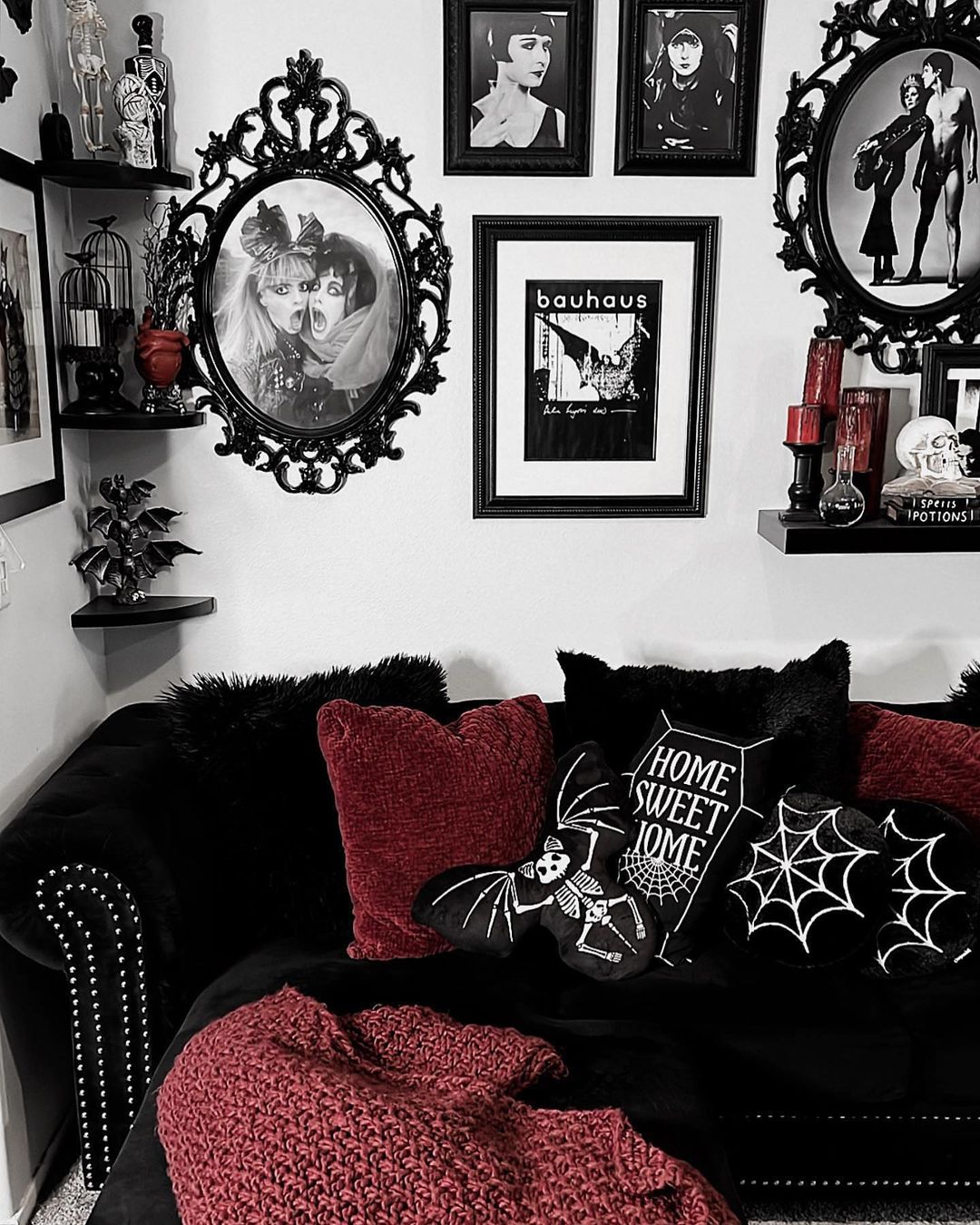 Combine Gothic Artwork with Rich Textiles for a Cozy Halloween Nook