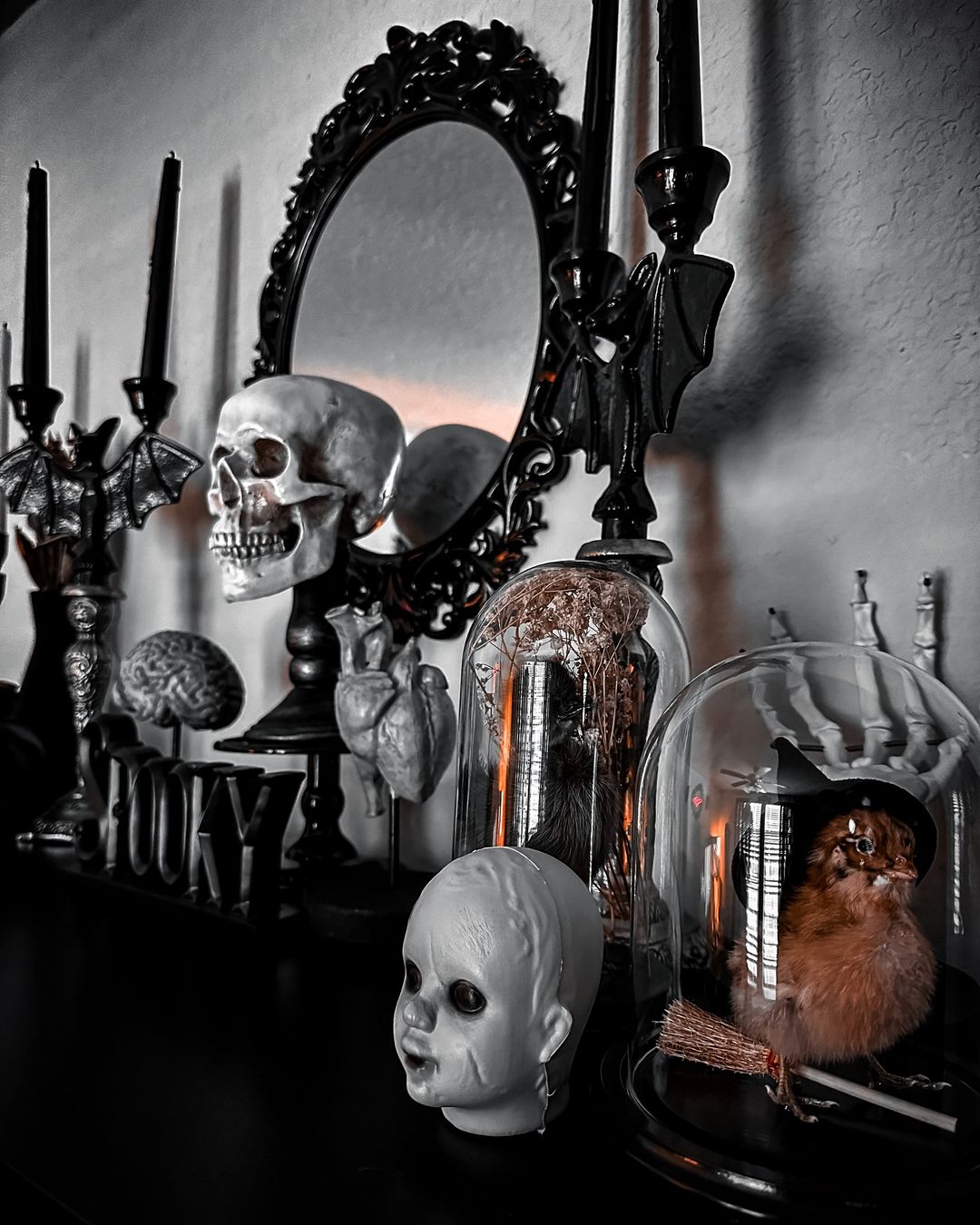 16. Create a Gothic Mantel Display with Skulls and Creepy Artefacts