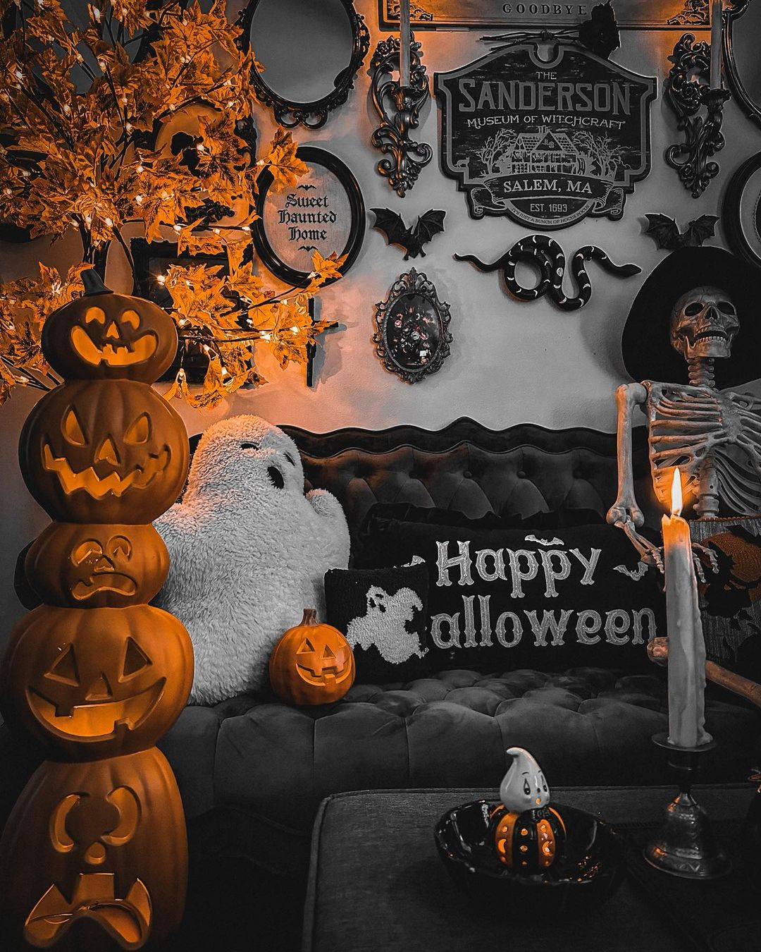 5. Create a Spooky Gothic Halloween Lounge with Pumpkin Stacks and Haunted Decor