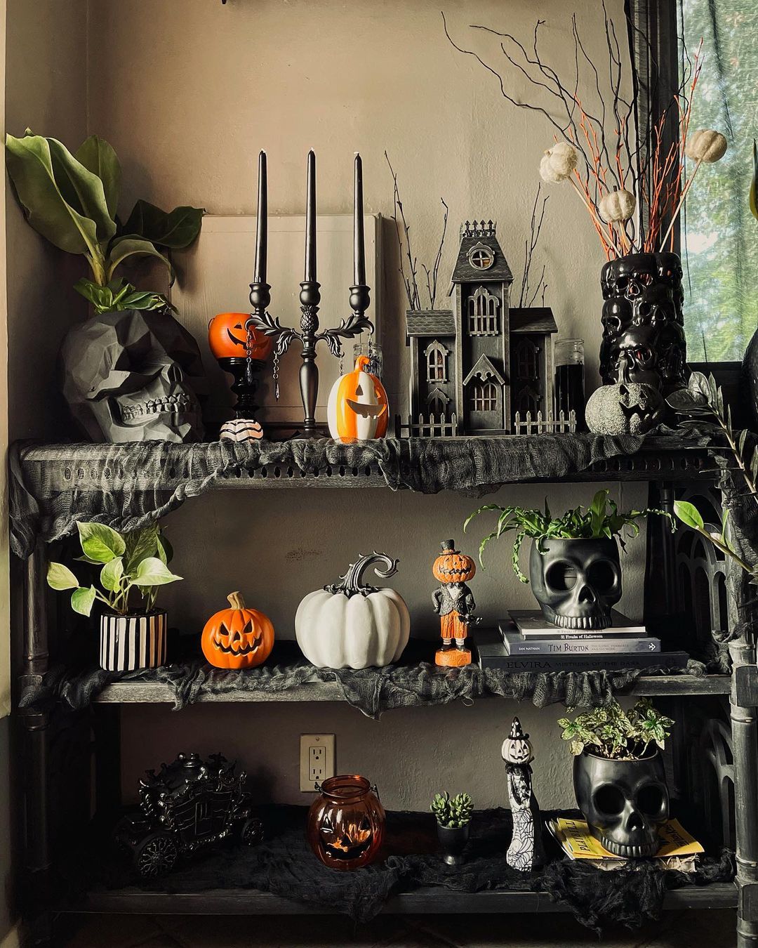 Curate a Gothic Halloween Shelf with Skulls and Haunted Decor