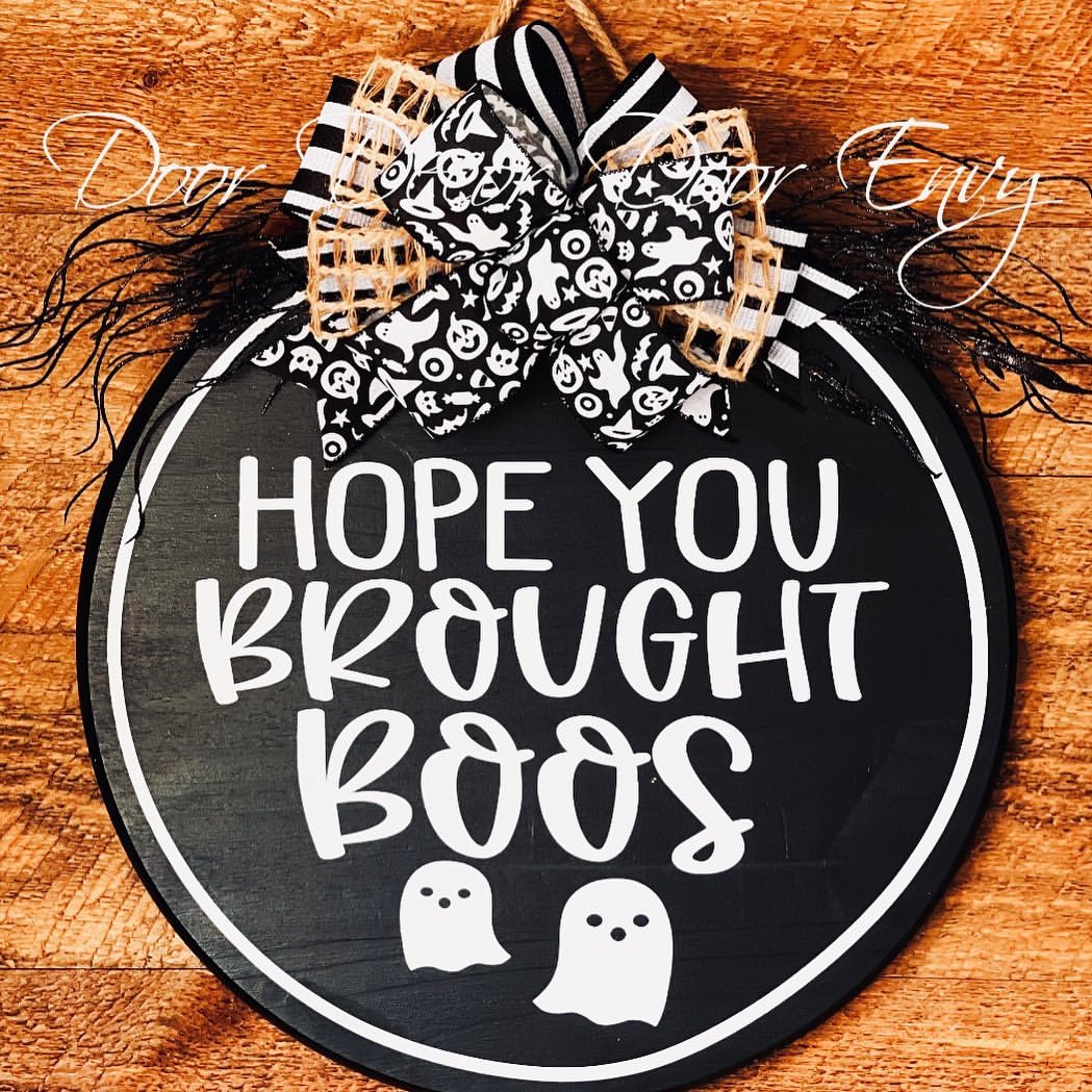 Playfully Spooky Sign with a Festive Bow for Halloween Fun