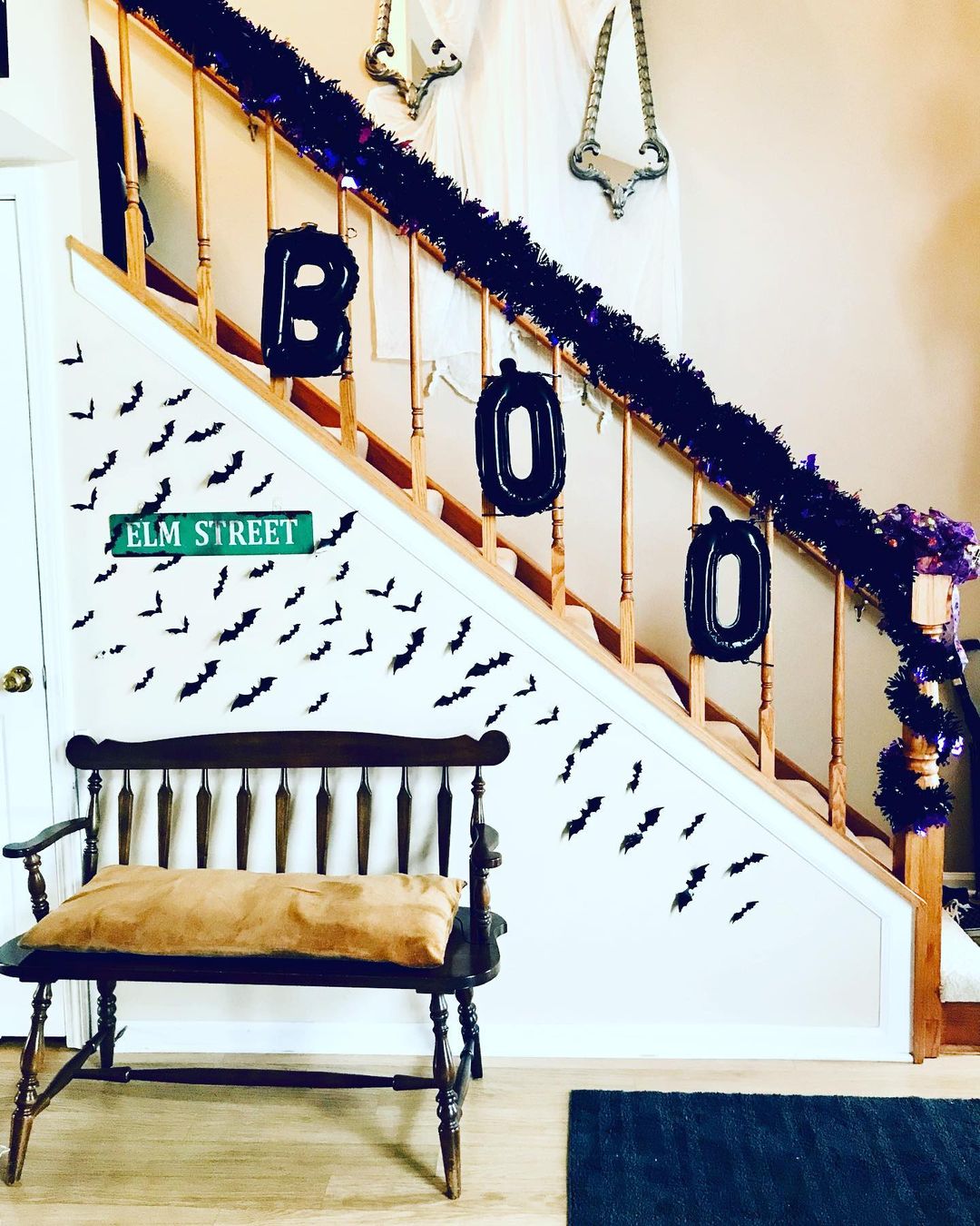 Fun Halloween Staircase with Bat Wall and "Boo" Garland